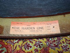 Close-up red rectangular paper label, The Harden Line, Camden, N.Y.